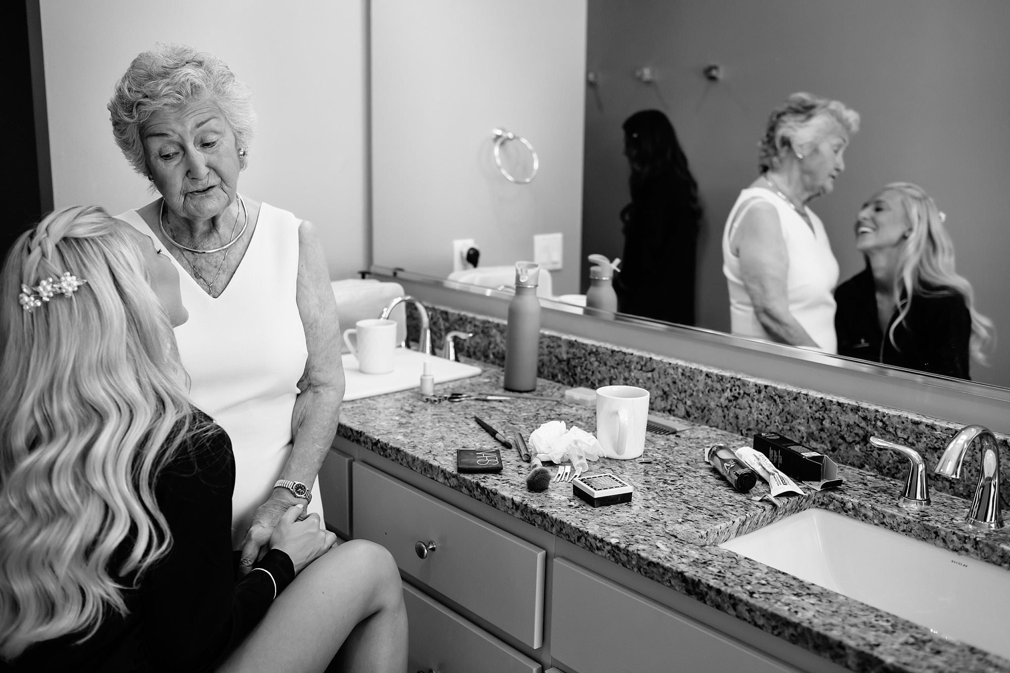 Black and white of Bride and Grandmother laughing during bridal prep