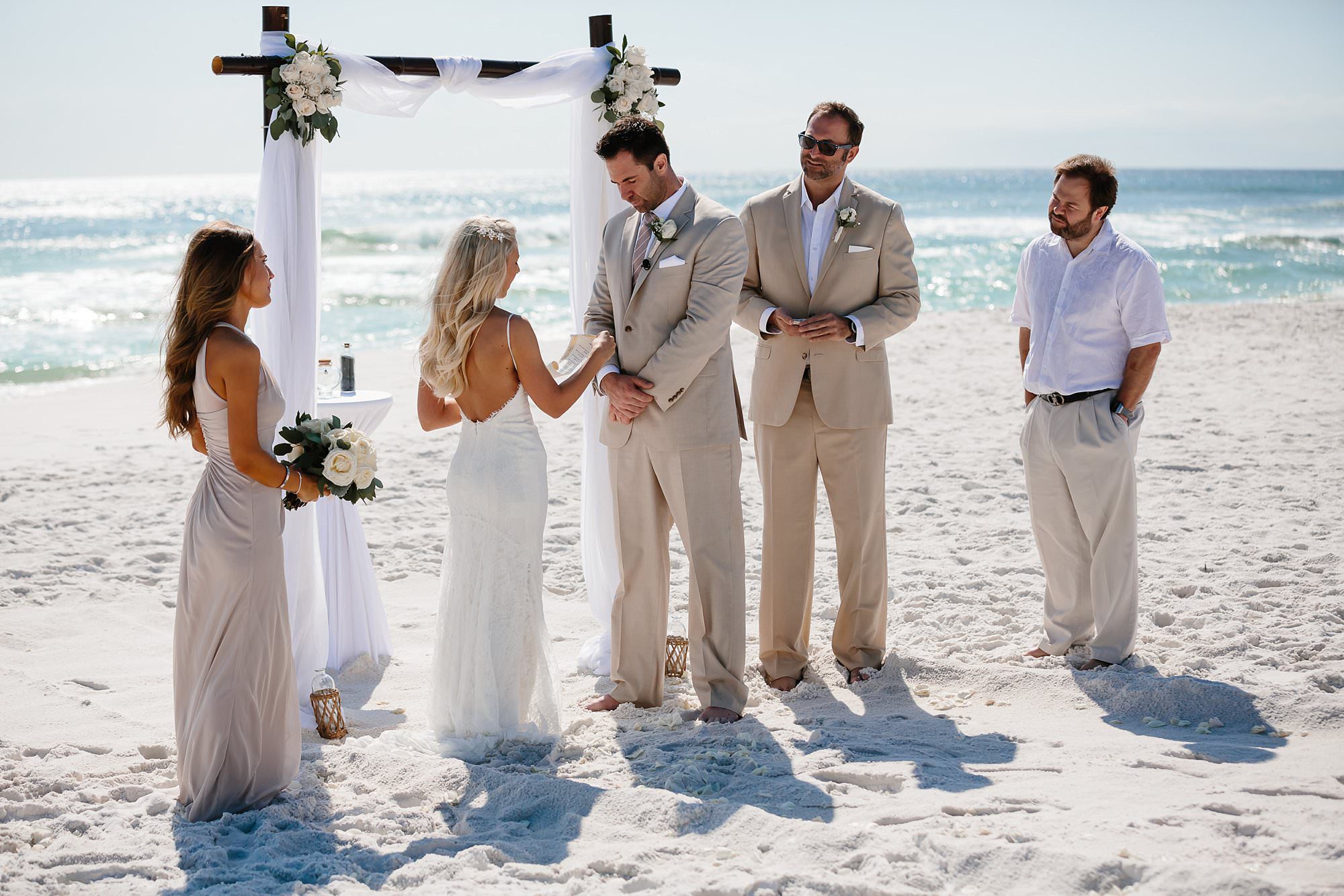 Vow exchange at beach wedding at Henderson Beach State Park