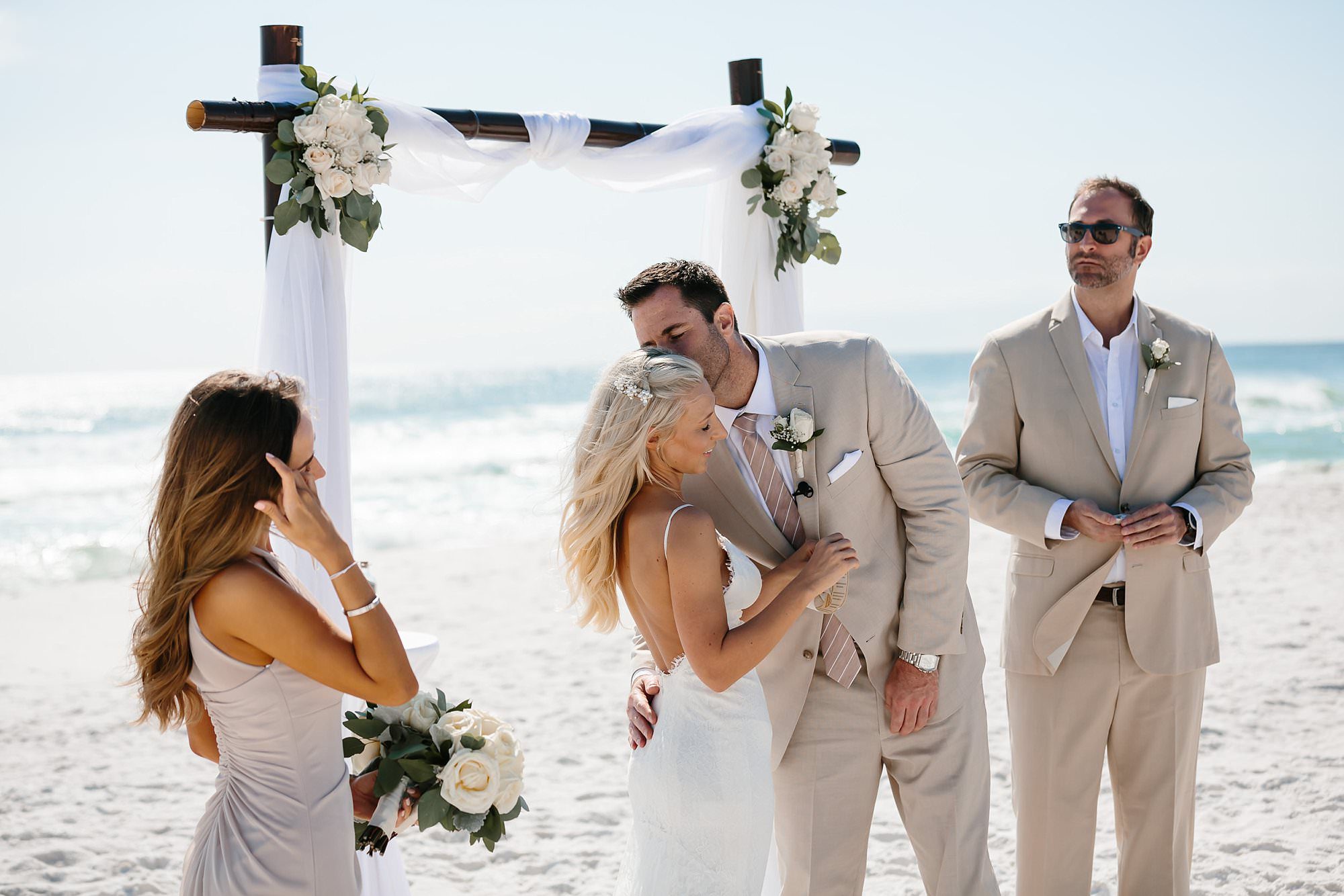 Vow exchange at beach wedding at Henderson Beach State Park