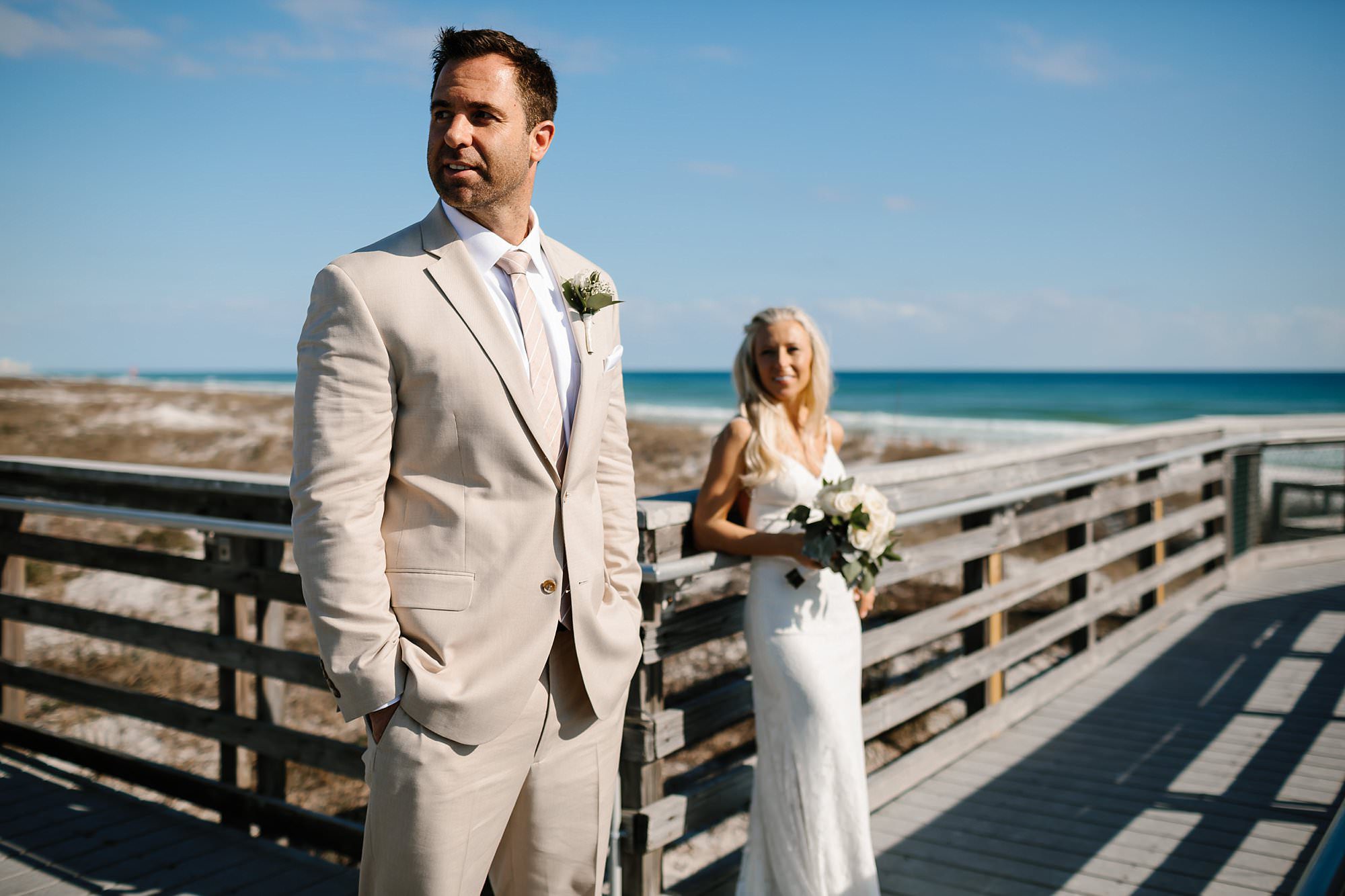 Portraits of bride and groom on the boardwalk at Henderson Beach State Park Destin Florida