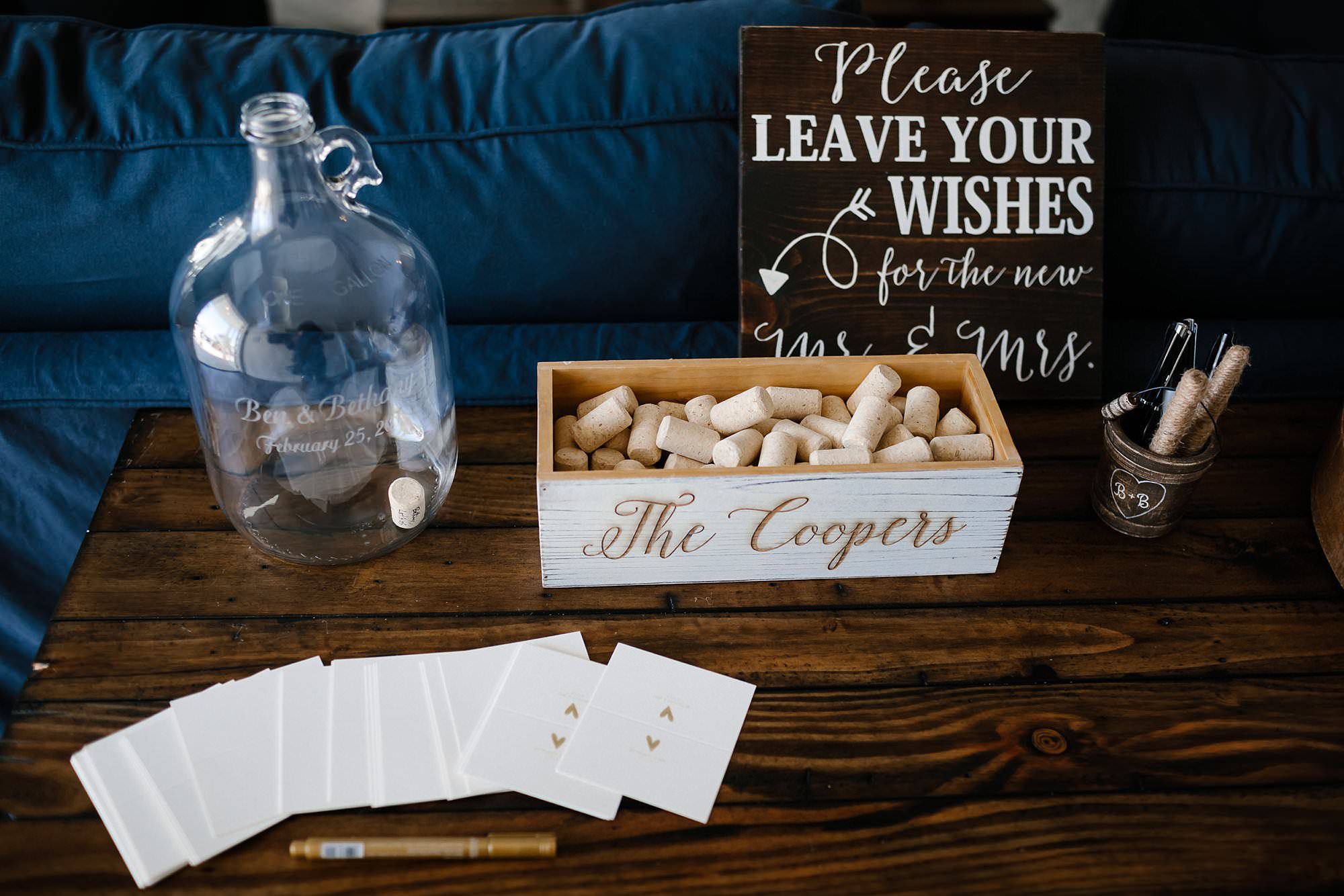 Unique wedding signage note cards and loose wine corks for guest to sign and place in glass bottle
