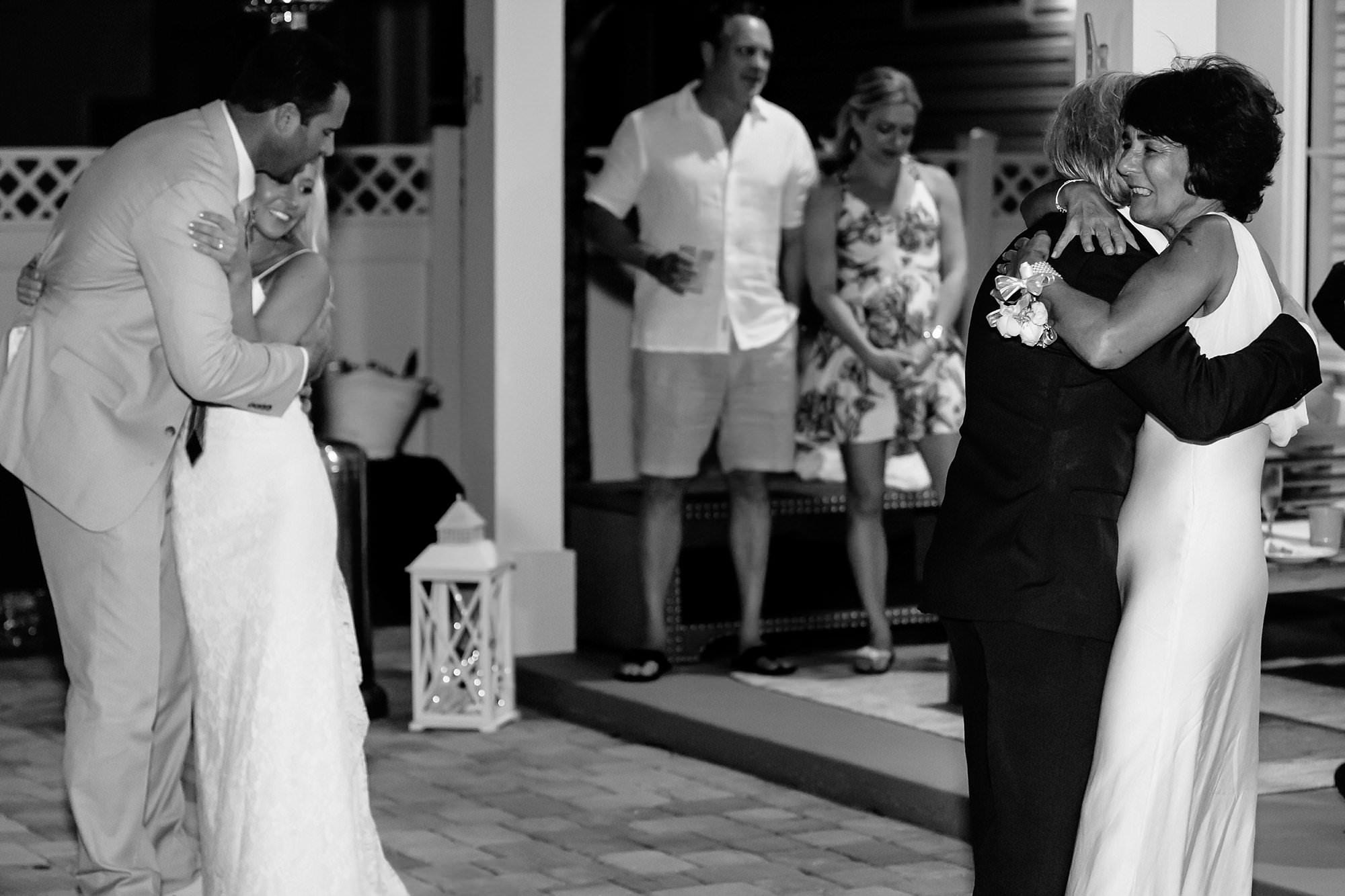 Black and white portrait of first dance portrait of bride, groom and brides parents