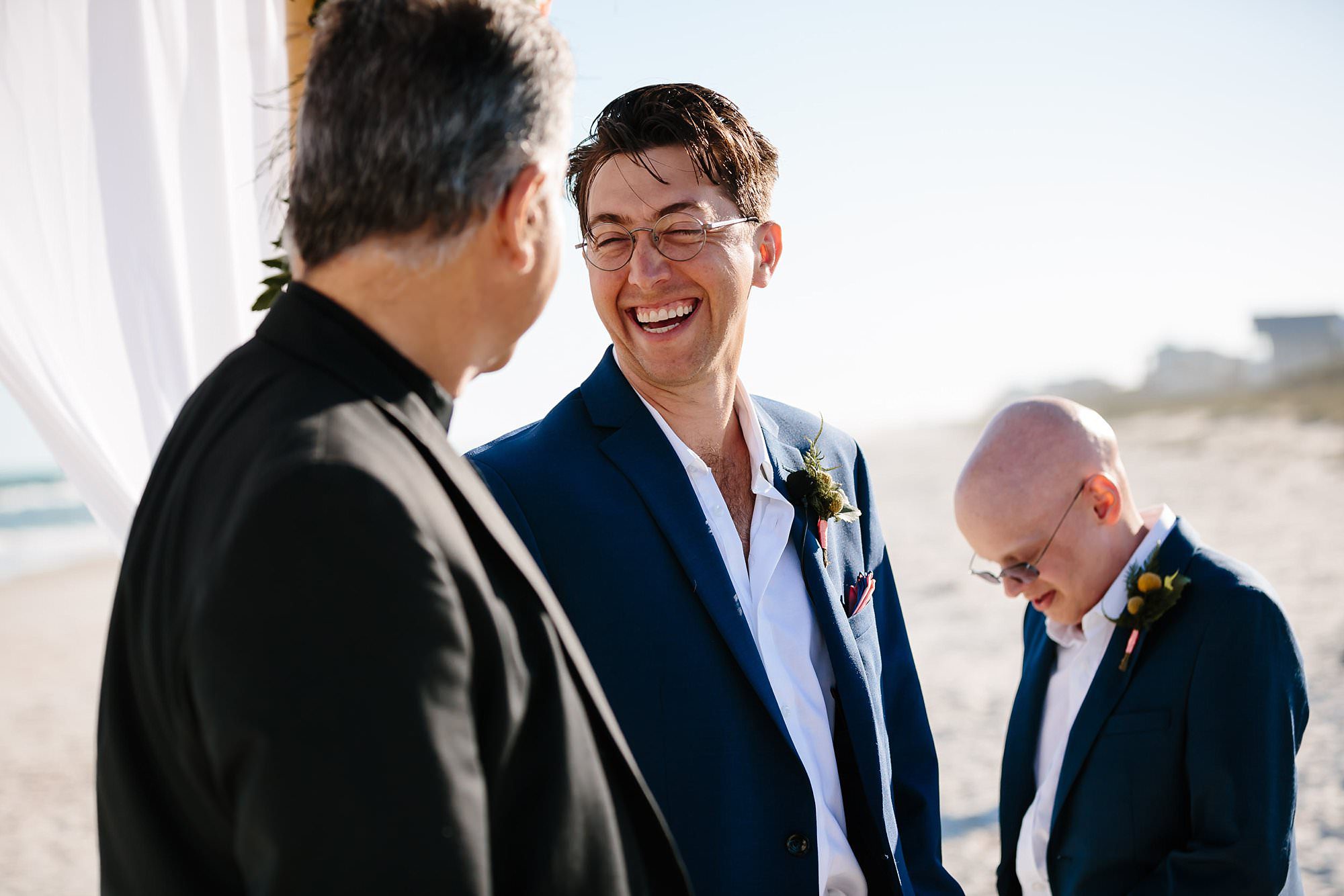 Groom and minister laughing