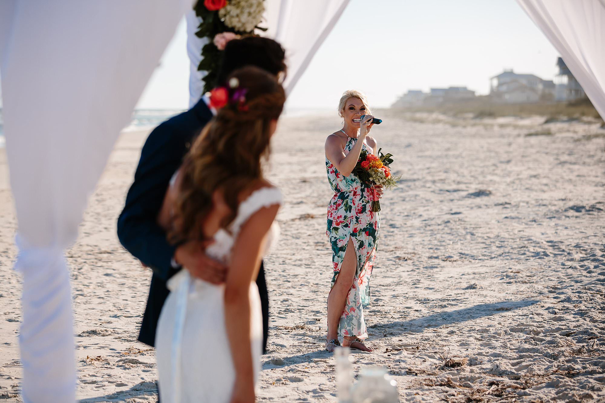 Bridesmaid singing at beach ceremony on St George Island Fl