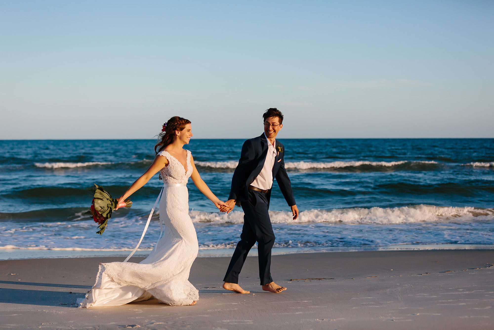 Bride and groom portraits on St George Island beach after ceremony 