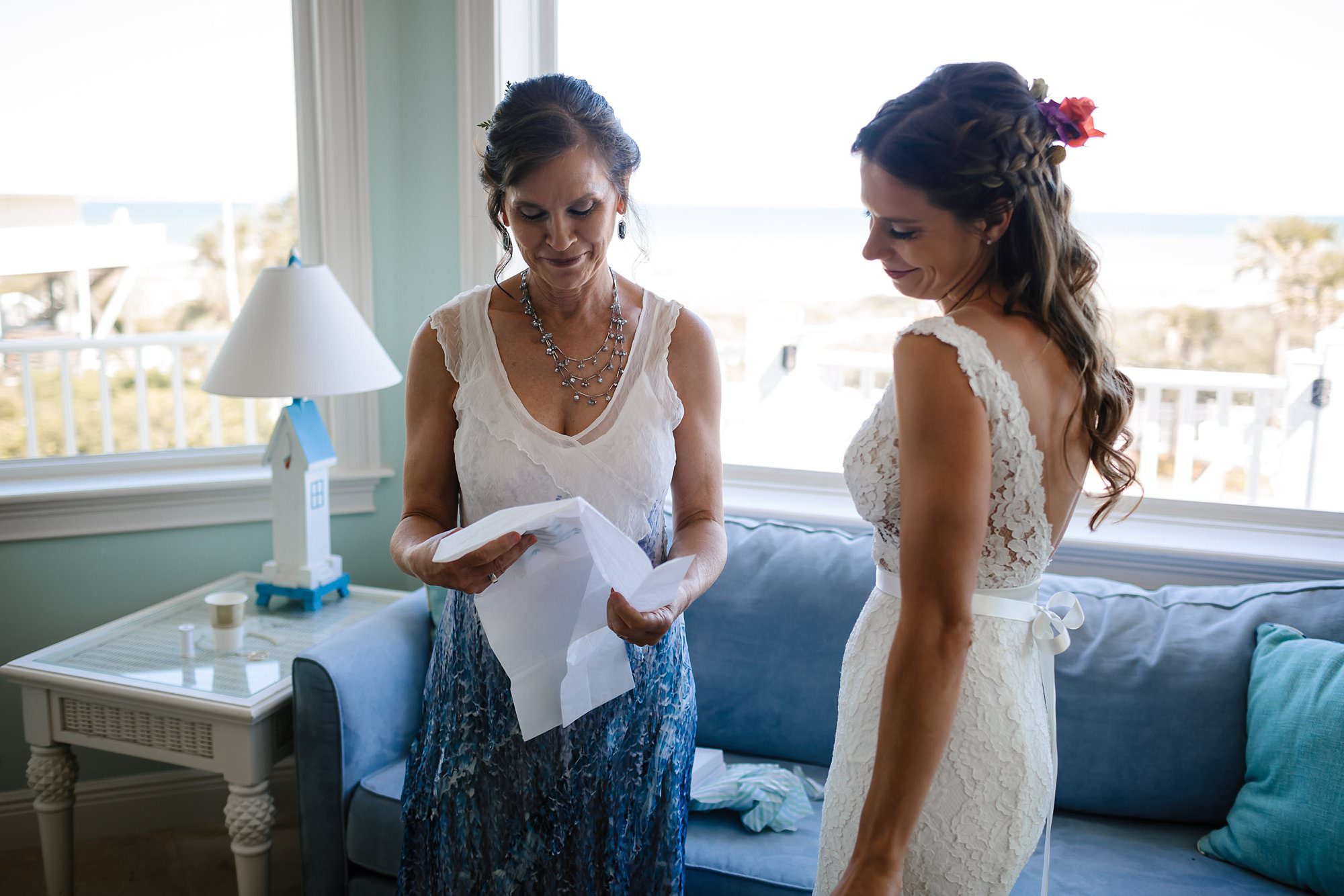 Bride giving gift to mother