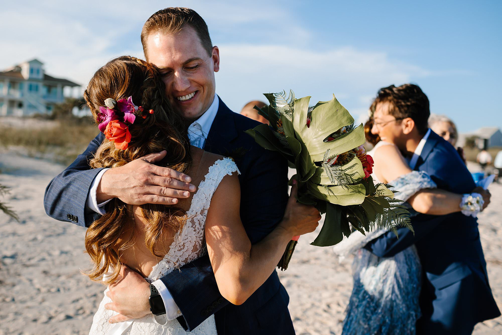 Hugs and tears after recessional at beach ceremony on St George Island Fl