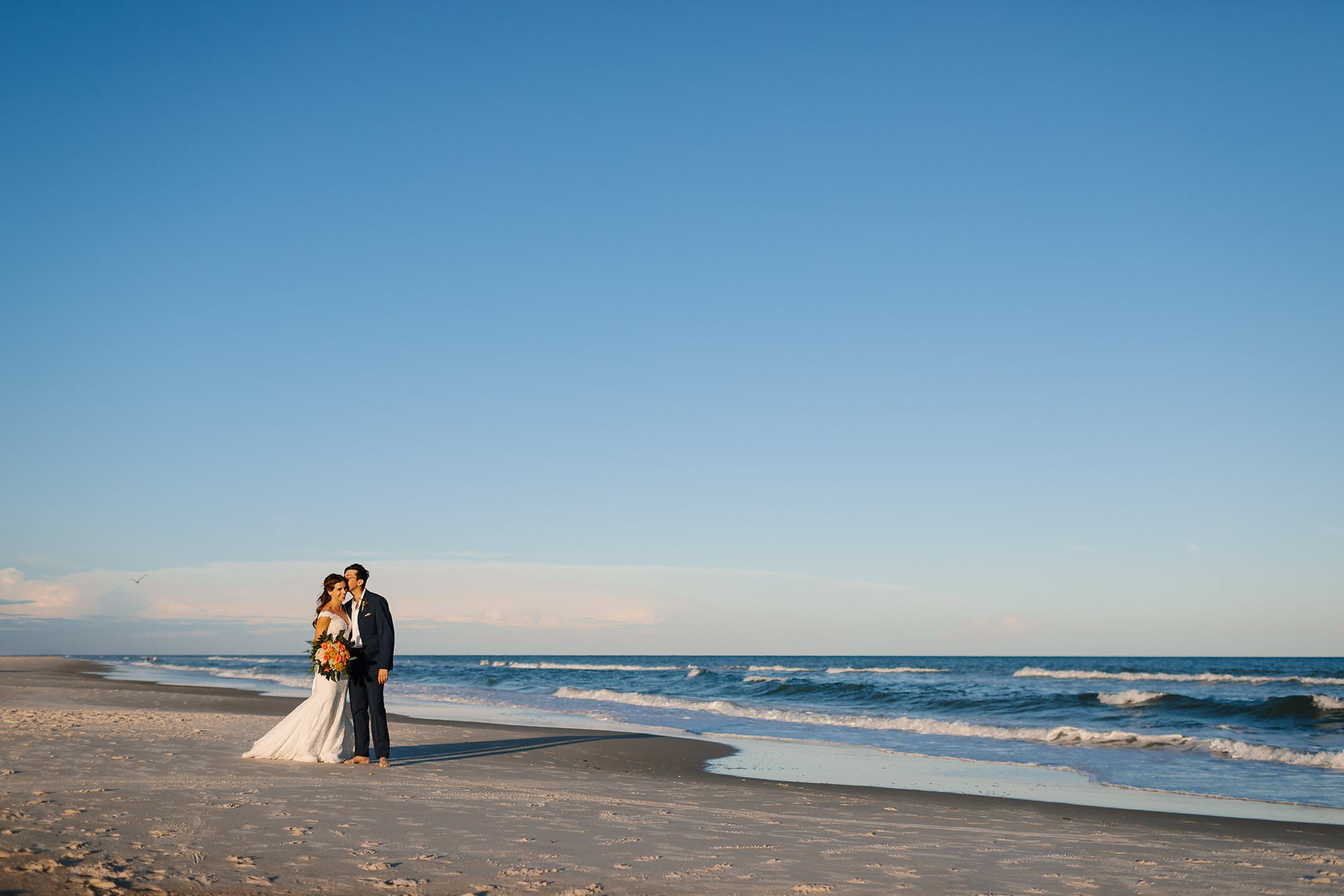 Bride and groom portraits on St George Island beach after ceremony 