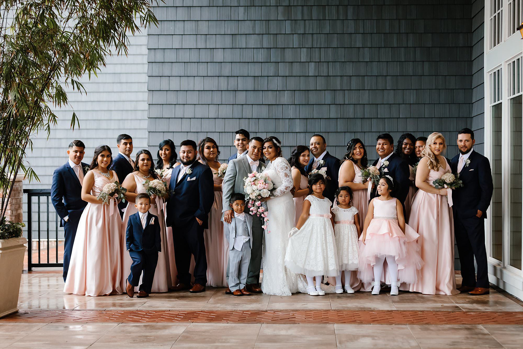 Large wedding party on the covered terrace of the Henderson Beach Resort and Spa 