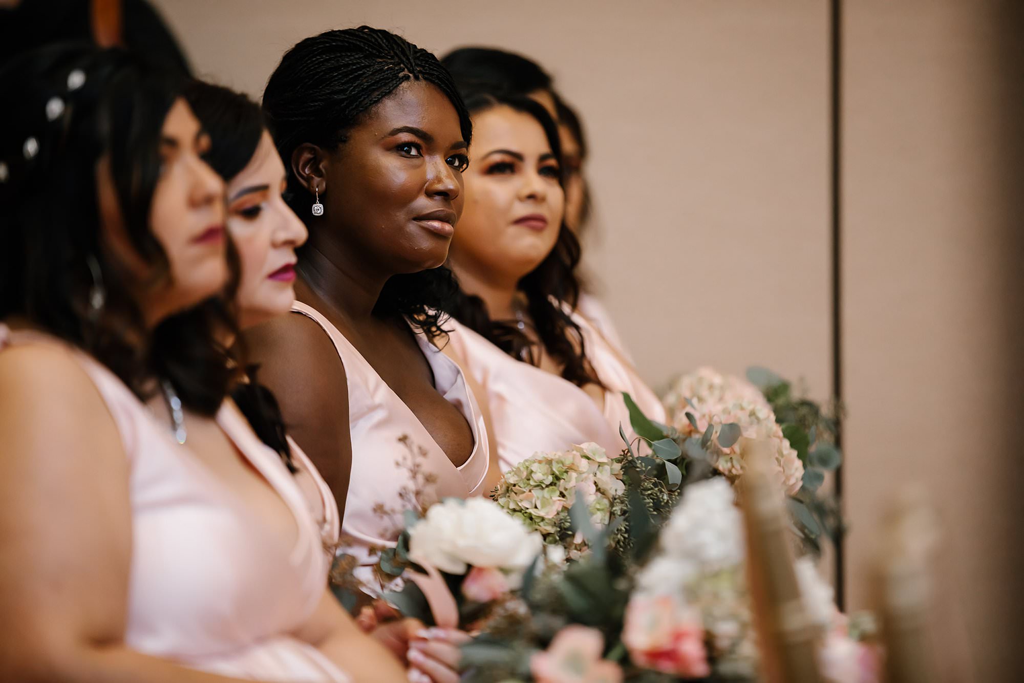 Bridesmaids watching ceremony at Henderson Beach Resort and Spa