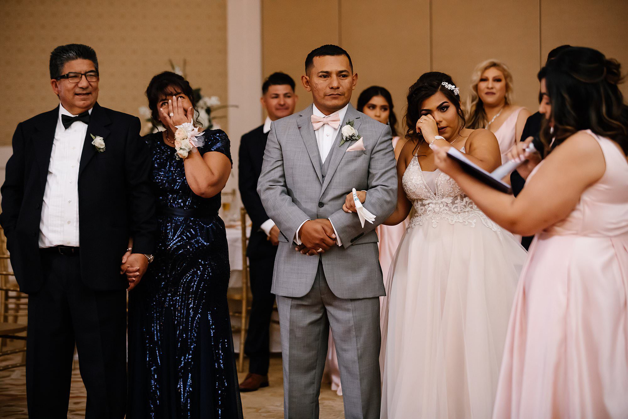 Couple and brides parents crying during Matron of Honors speech