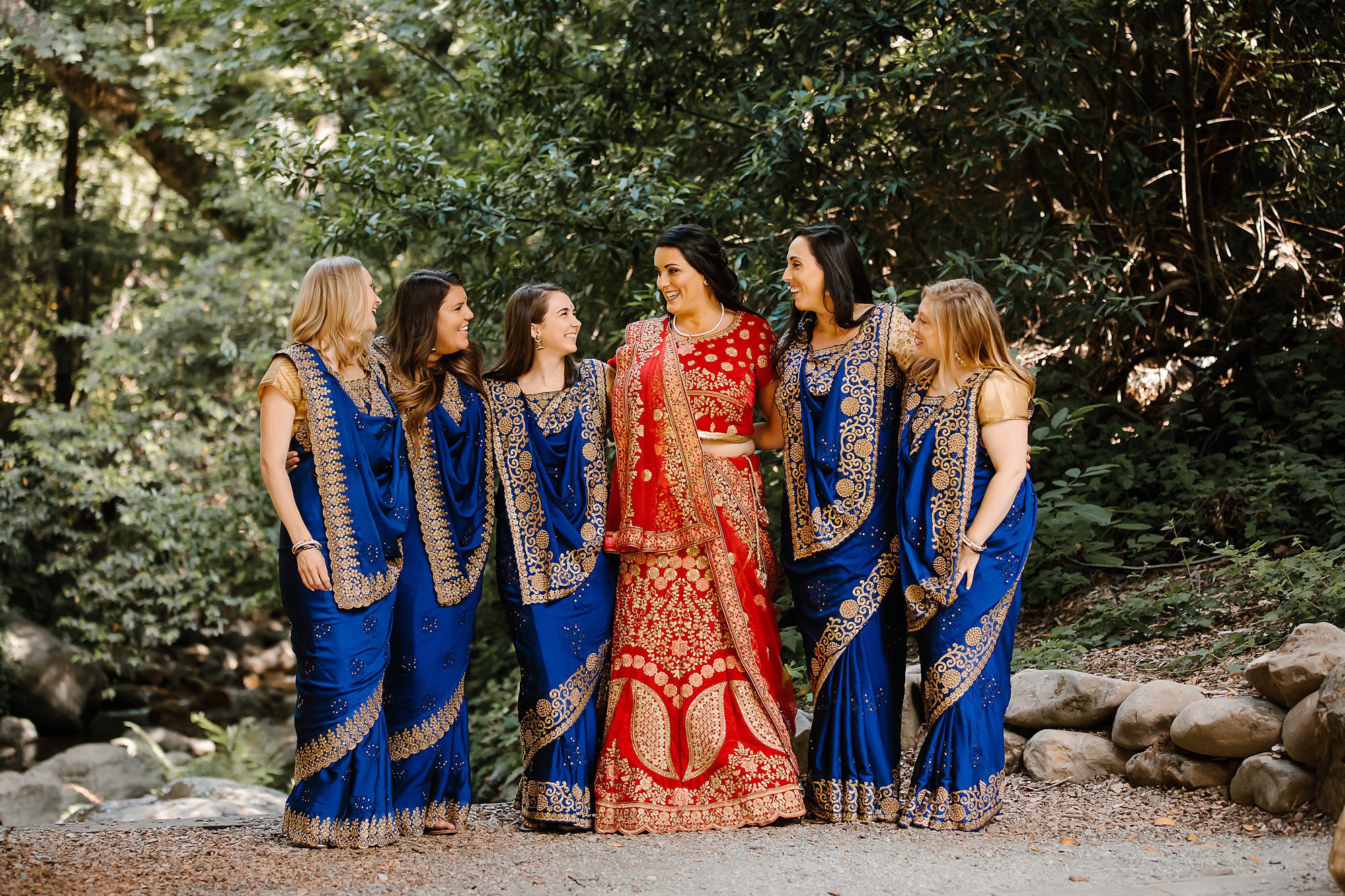 Bridal party in royal blue saree's and bride in red saree at Saratoga Springs wedding