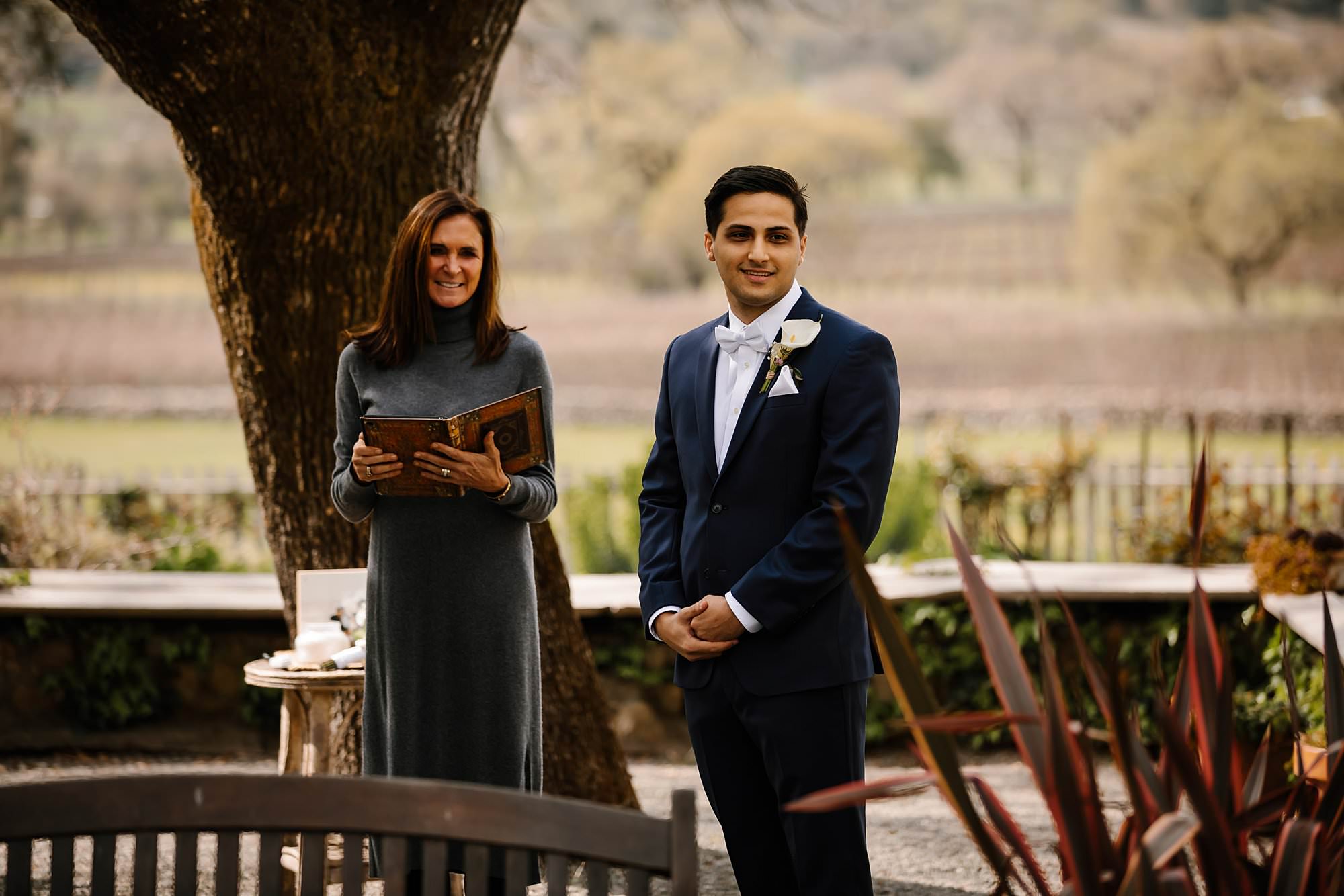 Groom smiles as he see's his bride for the first time at their Beltane Ranch elopement