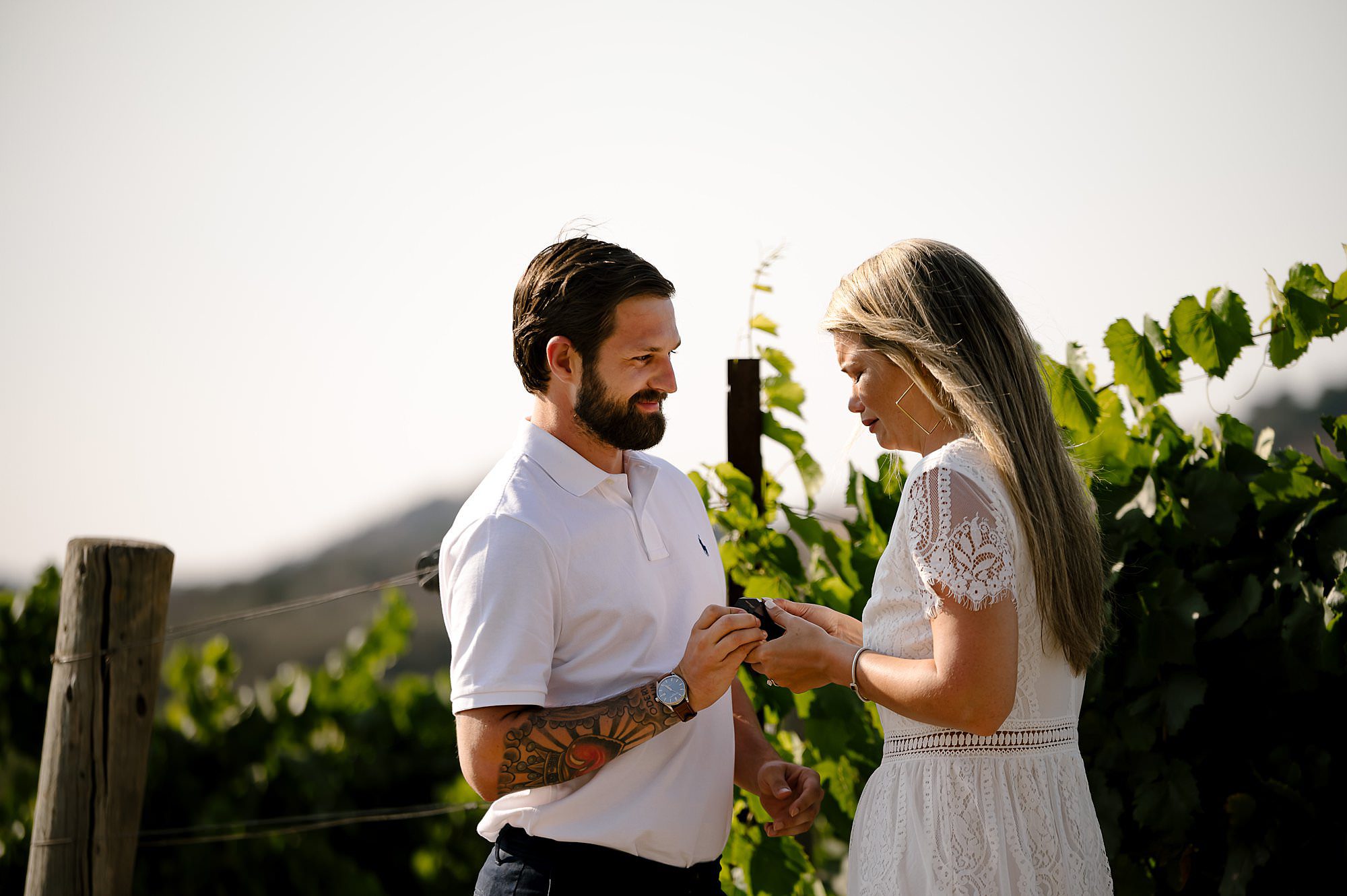 Cameron shows Melissa the ring box after proposing in the vineyard after proposal at Domaine Carneros in Napa.