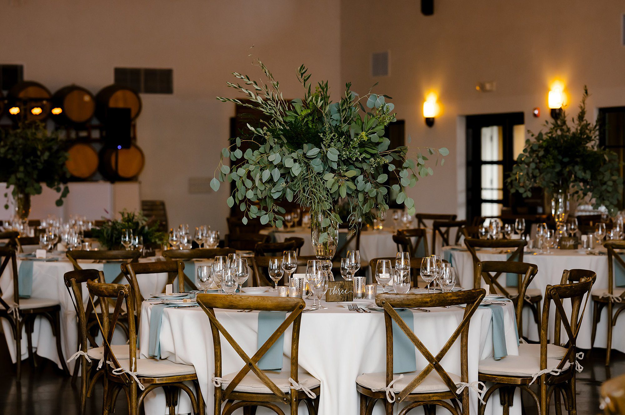 Round tables decorated with greenry at Viansa Winery in Sonoma