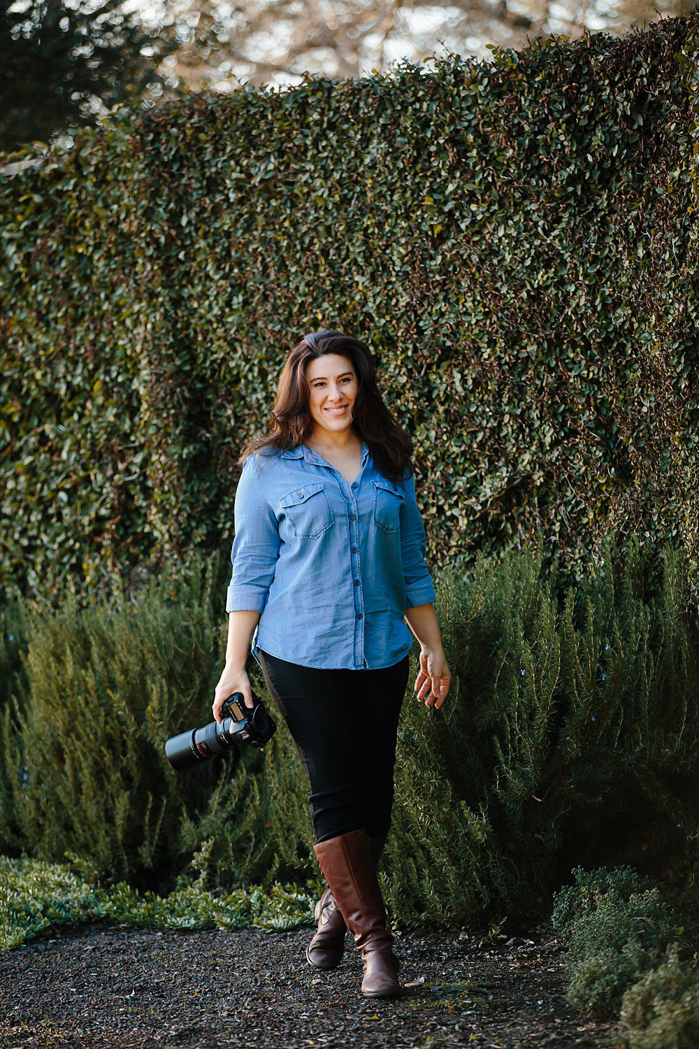 Napa Wedding Photographer Amy Little walking near an ivy covered wall