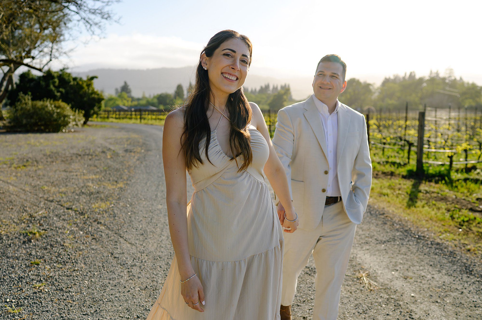 Jackie leads Nik down the path in Landmark Vineyards after they got engaged 