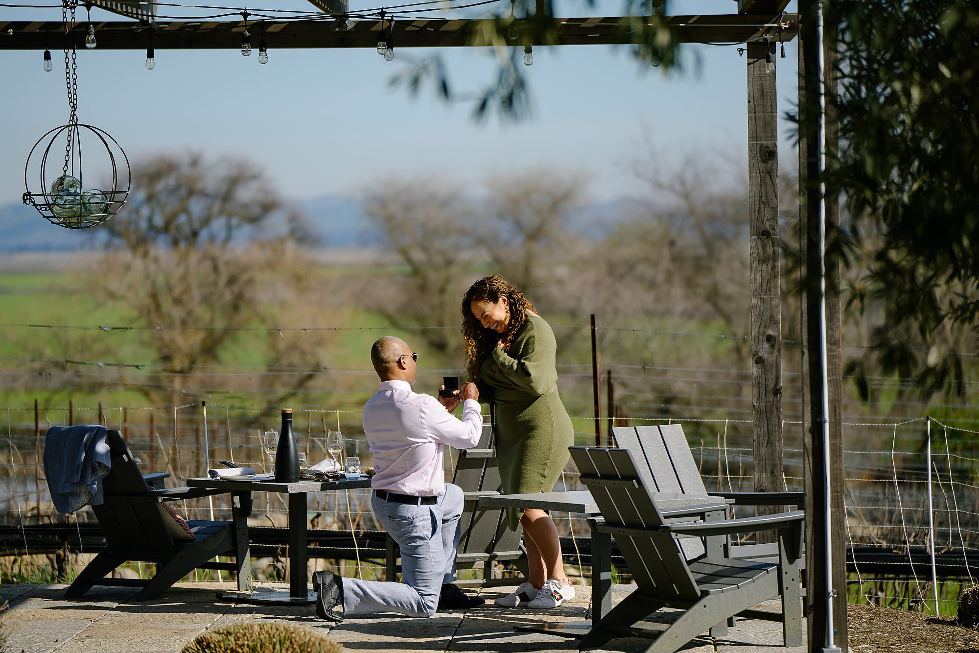 Courtney gets down on one knee to propose to Samar at Ram's Gate Winery in Sonoma, CA