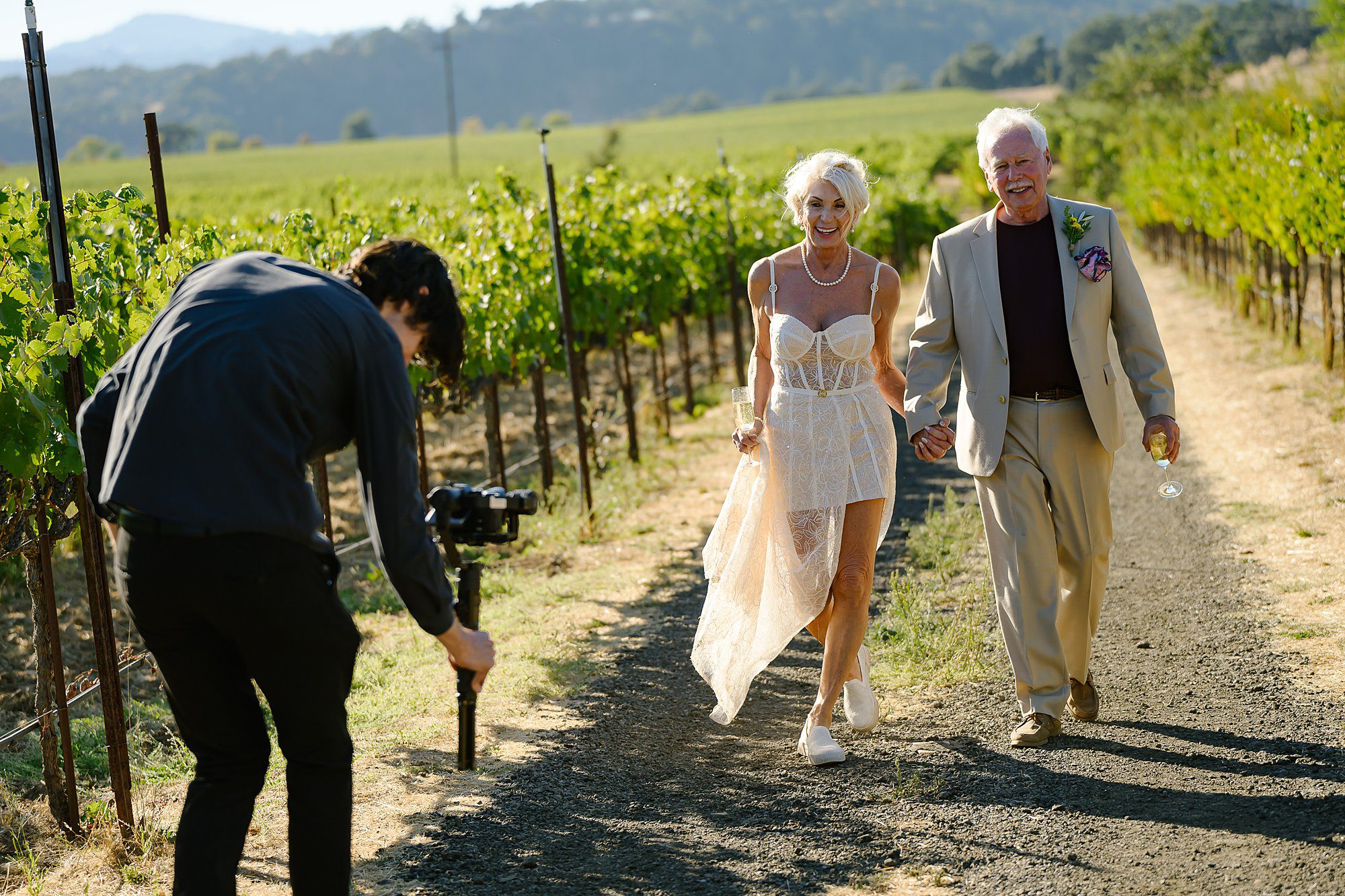xx filming Lynn and Barry walking through the vineyard after their elopement at Beltane Ranch