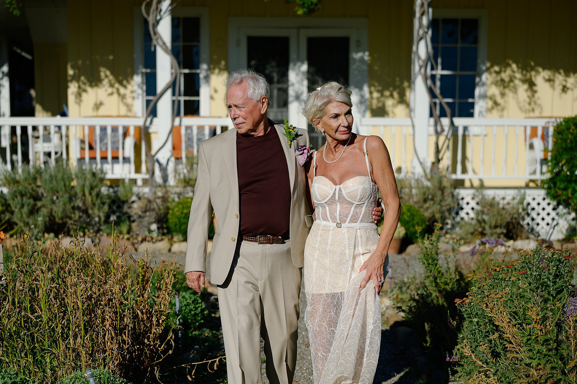 Lynn and Barry walking into the garden at Beltane Ranch