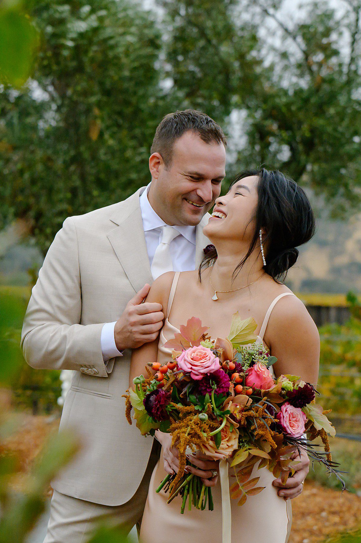 May and Mark flirting in the vineyard during their reception at the Four Seasons in Calistoga