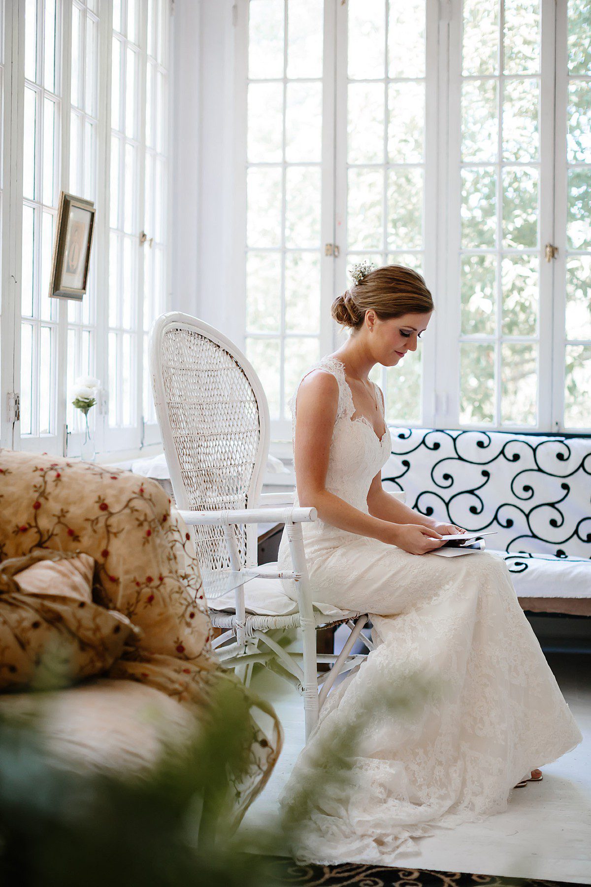 Bride reading a letter before the ceremony
